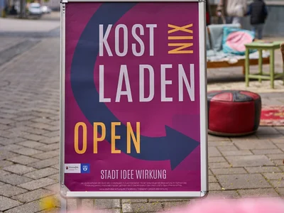 Werbeaufsteller für den KostNixLaden